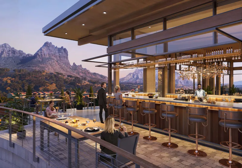 Rendering of the destination restaurant bar opening to red rock views through hangar doors